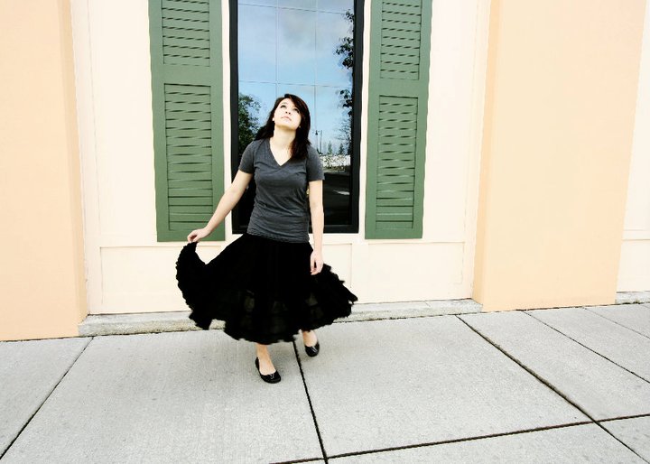 Savanna looking up wearing a black skirt